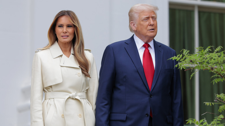 Melania Trump and Donald Trump standing