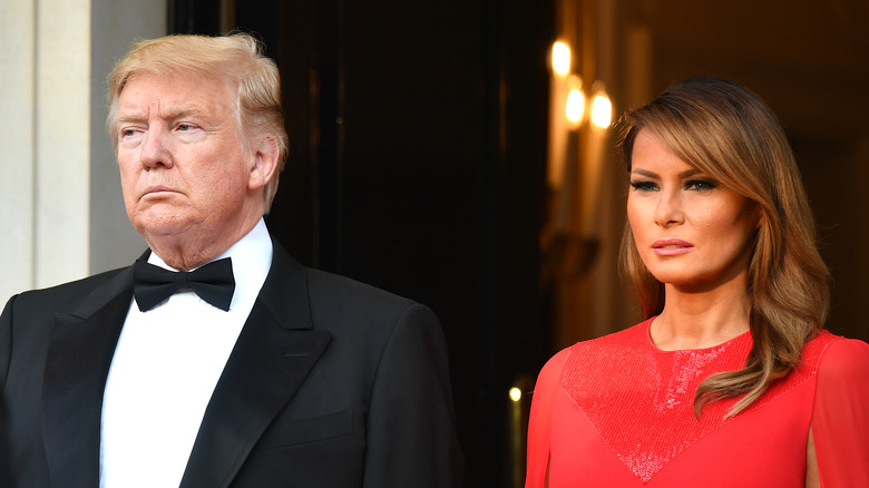 Donald and Melania Trump staring