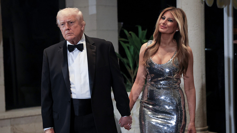 Donald Trump and Melania Trump holding hands