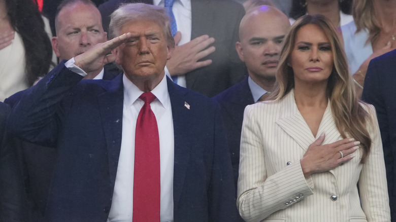 The Trumps stand for the national anthem at the 2025 military parade