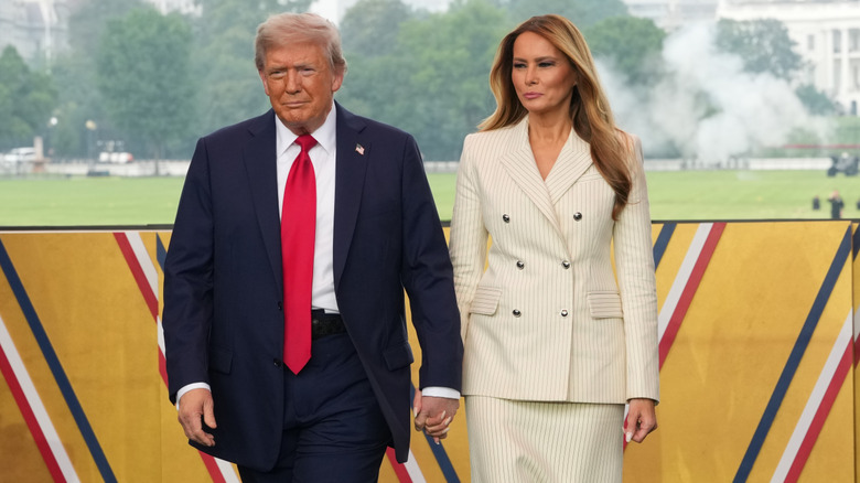 Donald and Melania Trump step onto the stage at the president's military parade