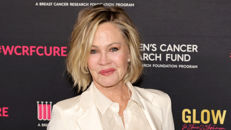 Melanie Griffith posing on step-and-repeat in 2024