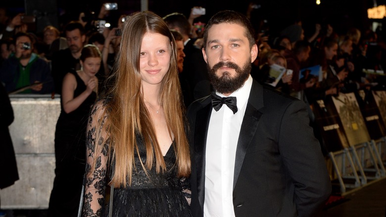 Mia Goth and Shia LaBeouf posing