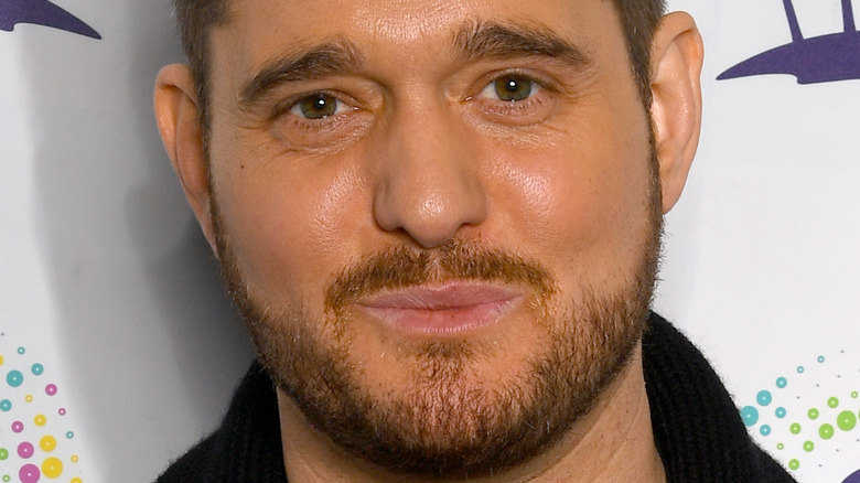 Michael Buble smiling tightly