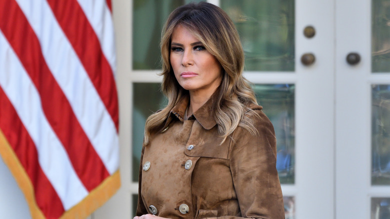 Melania Trump in a brown jacket