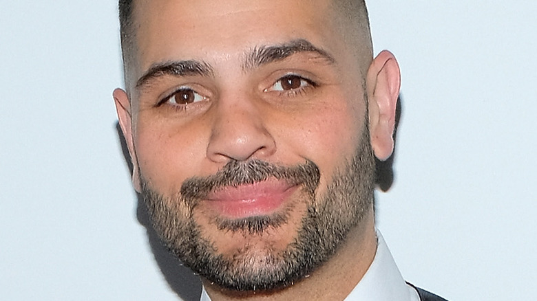 Michael Costello smiling on the red carpet