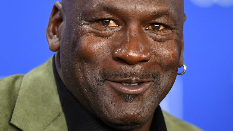 Michael Jordan older in green suit