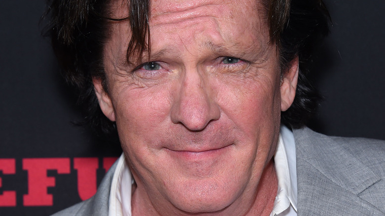 Michael Madsen squinting and smiling
