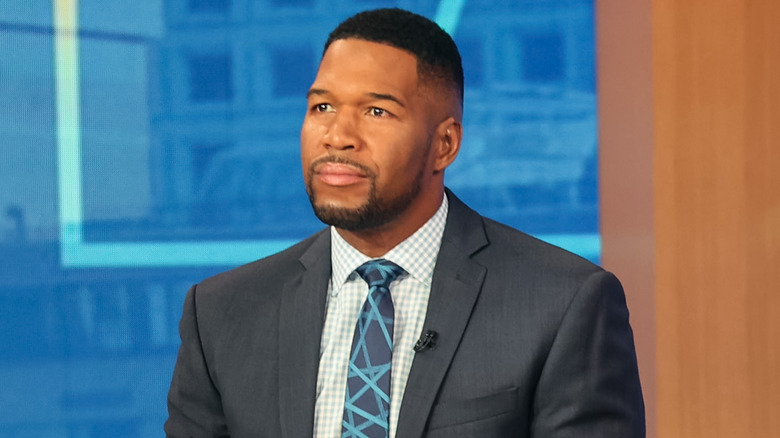 Michael Strahan, smirking on Good Morning America set