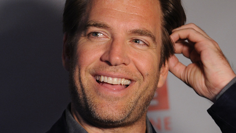 Michael Weatherly touching side of head