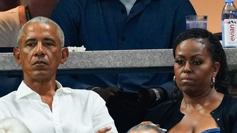 Barack Obama at a tennis match with Michelle Obama