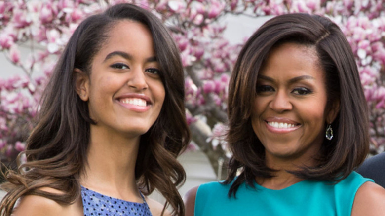 Malia and Michelle Obama smiling