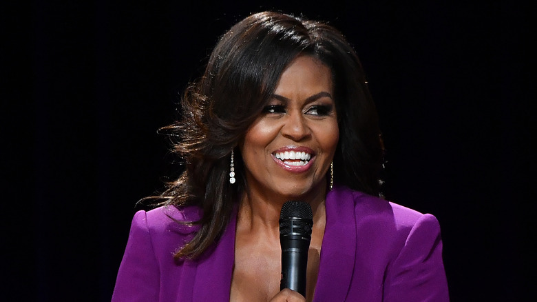 Michelle Obama holding microphone