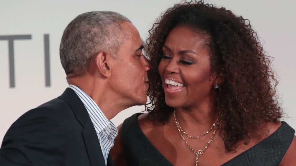 Barack Obama kisses Michelle Obama