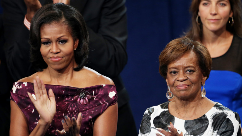 Michelle Obama and mother Marian Robinson clapping
