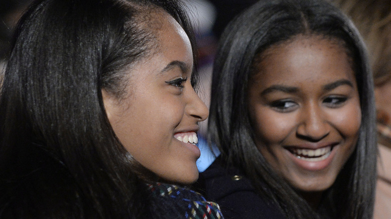Malia and Sasha Obama laughing