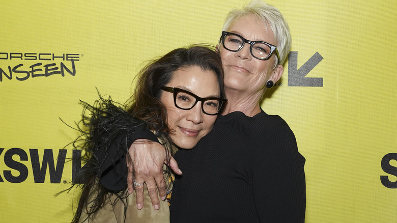 Michelle Yeoh and Jamie Lee Curtis embracing