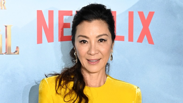 Michelle Yeoh poses on the red carpet