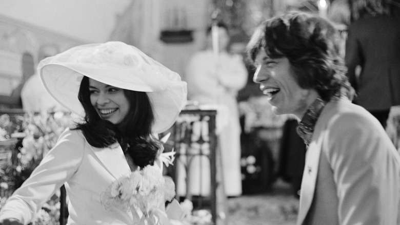 Mick and Bianca Jagger smiling at their wedding