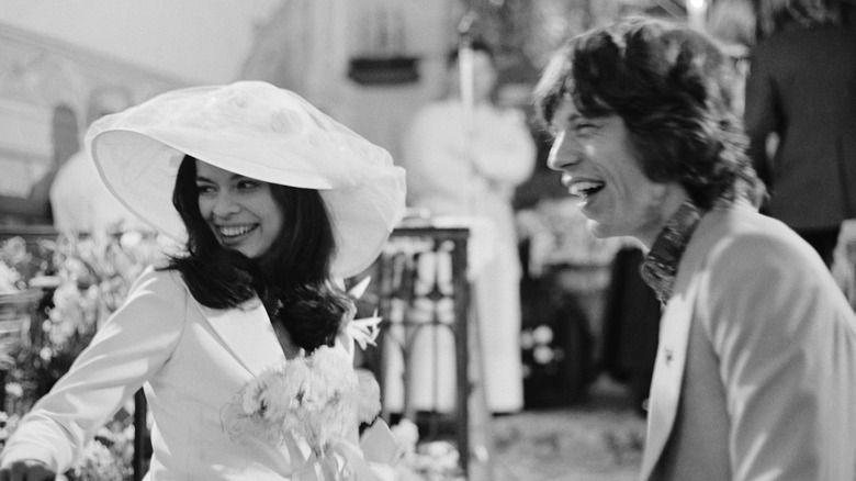 Mick and Bianca Jagger smiling at their wedding