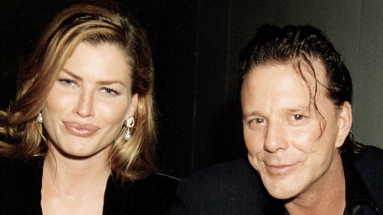 Mickey Rourke and Carre Otis pose in 1995