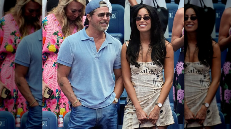 Brad Pitt and Ines de Ramon standing in the stands at the U.S. Open
