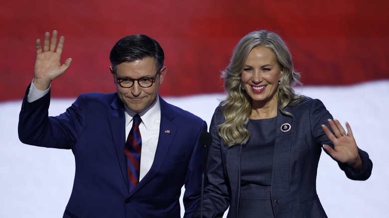 Mike and Kelly Johnson waving