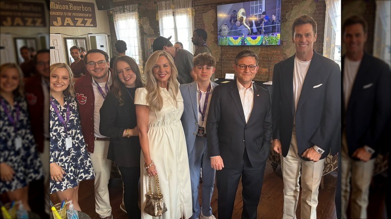 Mike and Kelly Johnson posing with kids, Tom Brady