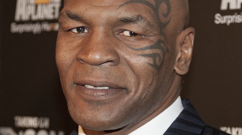 Mike Tyson smiling face tattoo