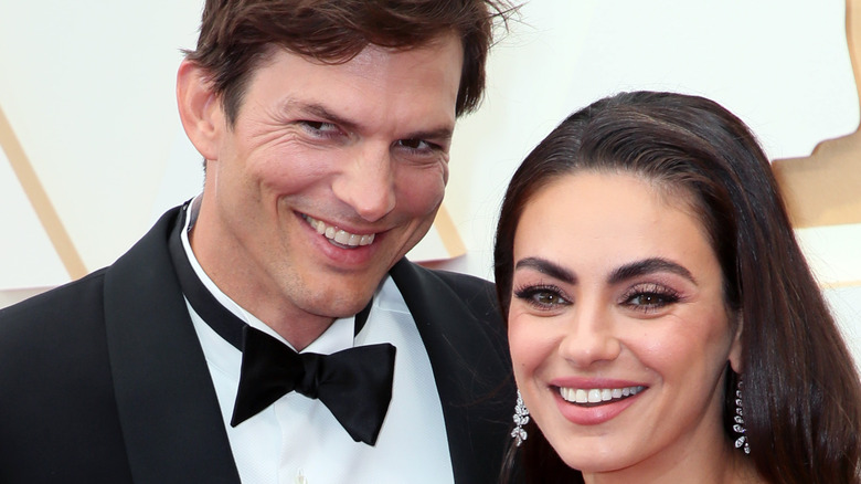 Ashton Kutcher and Mila Kunis smiling 