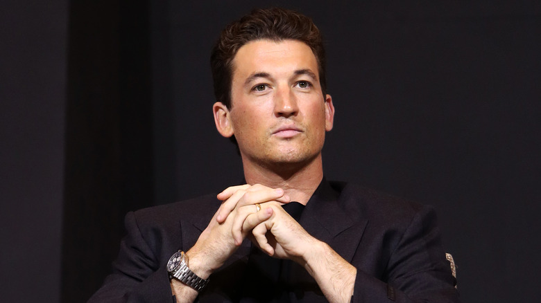 Miles Teller starring off into a crowd