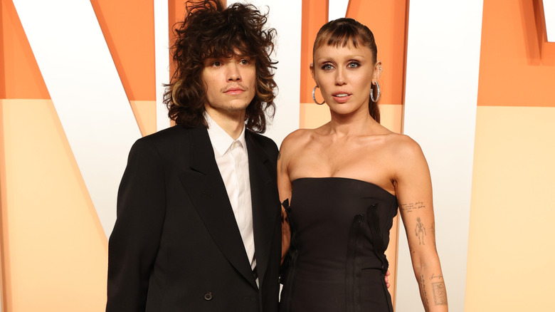 Miley Cyrus and Maxx Morando on the red carpet