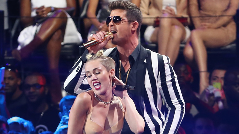 Miley Cyrus performing with Robin Thicke