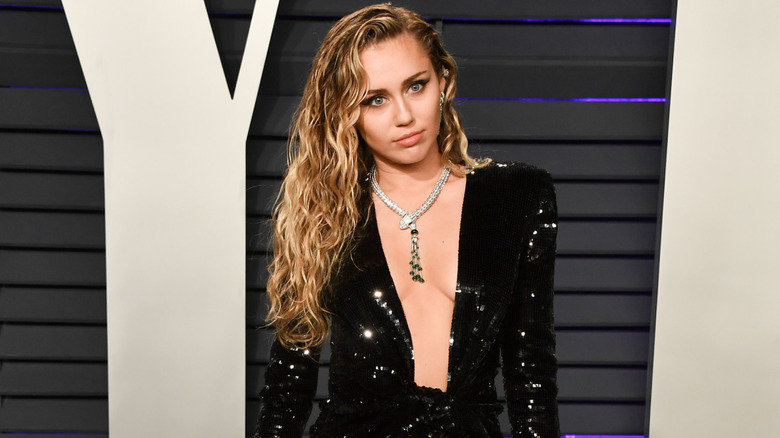 Miley Cyrus posing at an event