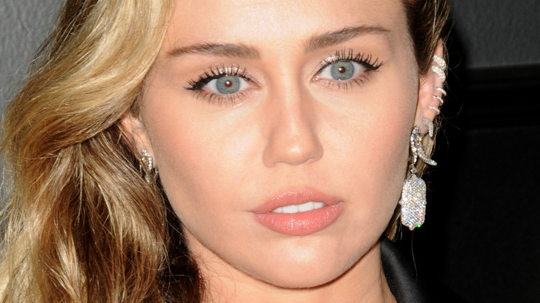Miley Cyrus wearing diamond earrings