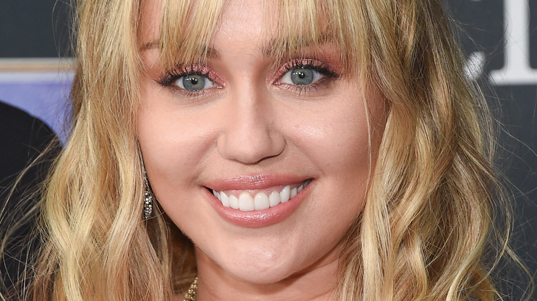 Miley Cyrus smiling on the red carpet