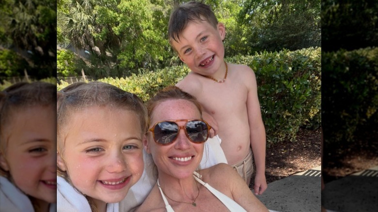 Mina Starsiak Hawk poses with her son and daughter