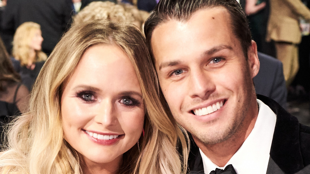 Miranda Lambert and Brendan McLoughlin smiling at an event