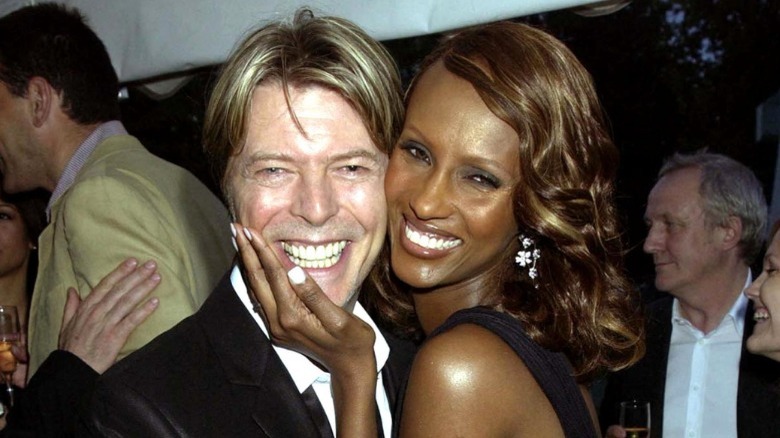 Iman holding David Bowie's face
