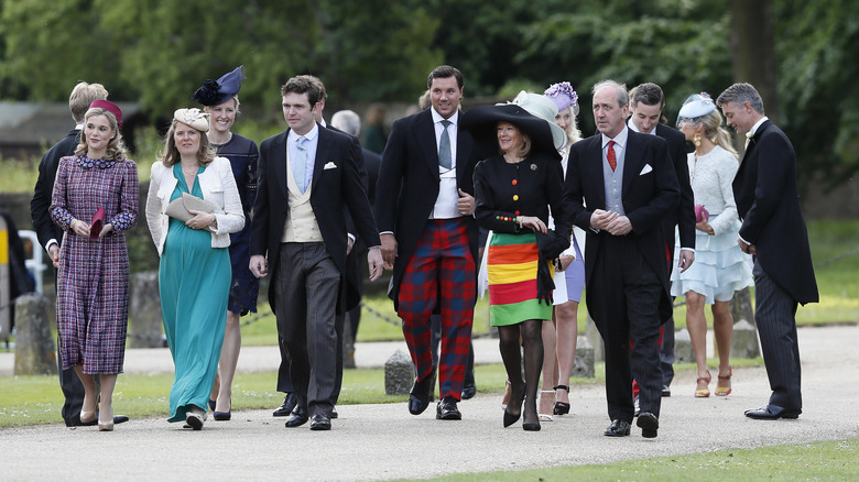 Royal wedding guests walking