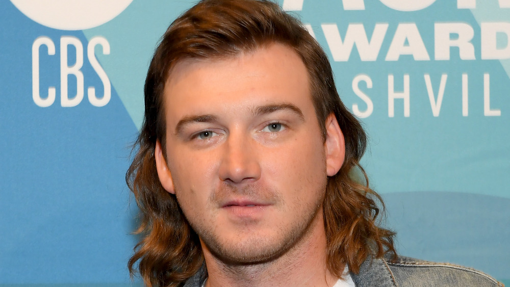 Morgan Wallen posing on the ACM Awards red carpet in Nashville, September 2019