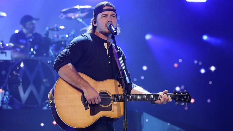 Morgan Wallen playing guitar