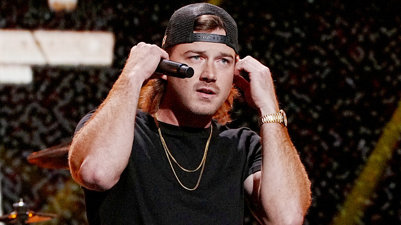 Morgan Wallen raising arms