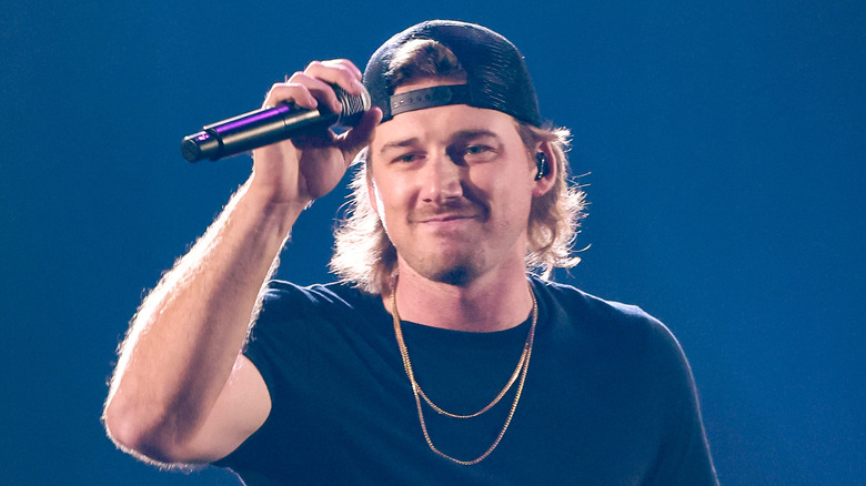 Morgan Wallen grabbing microphone