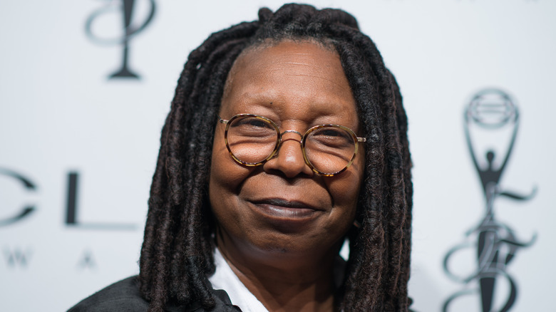 Whoopi Goldberg grinning
