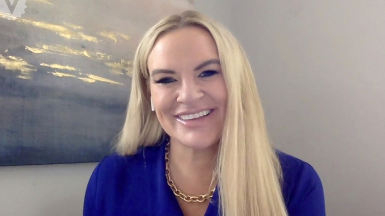 Heather Gay smiling with an airpod in