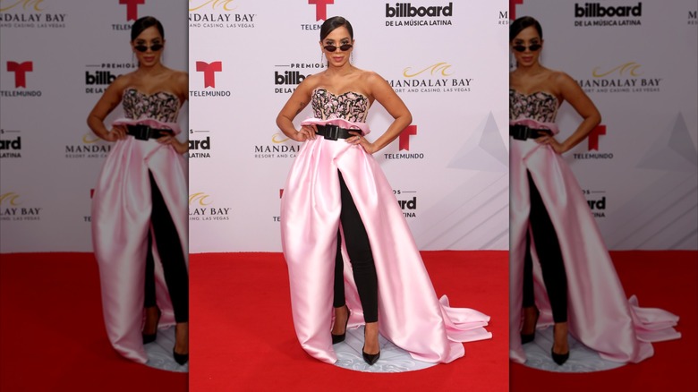 Anitta Latin at the Billboard Awards in 2019 wearing a black and pink dress
