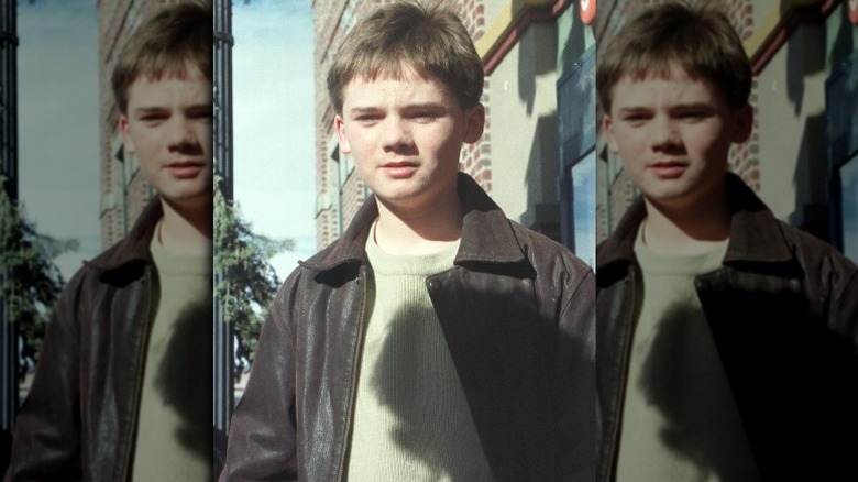Jake Lloyd looking down
