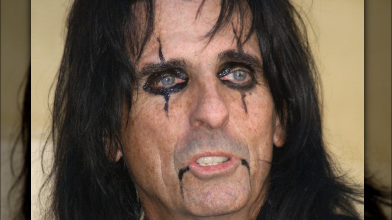 Alice Cooper wearing black makeup 