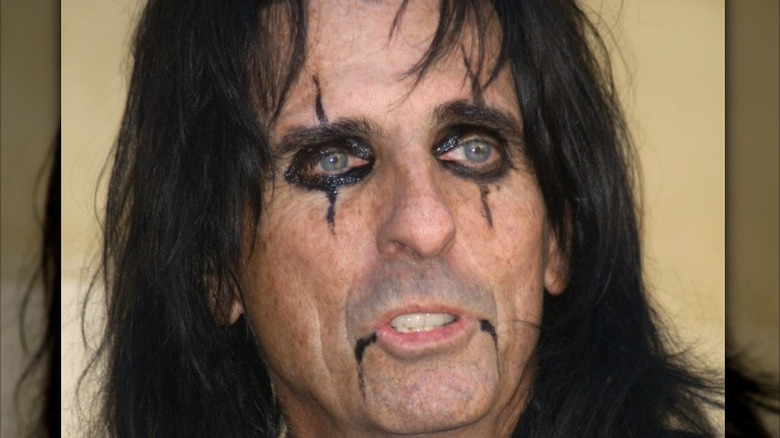 Alice Cooper wearing black makeup